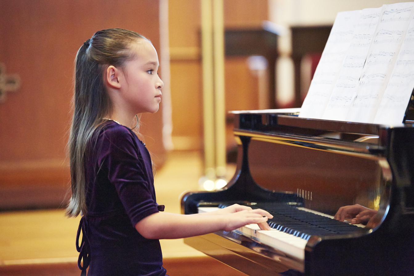 Student performing at CSM piano recital on a Yamaha grand piano